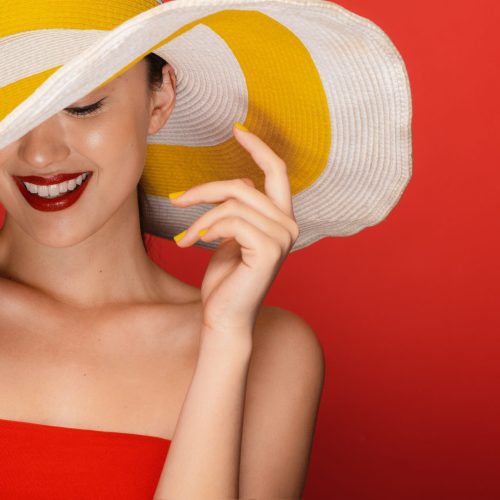 Red background Chinese lady wearing Red Dress and a Yellow Hat