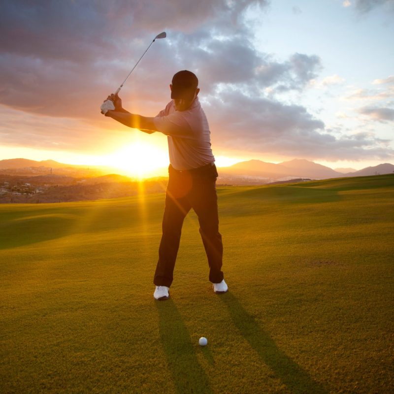 male golfer hitting ball on world class golf course in Mexico.