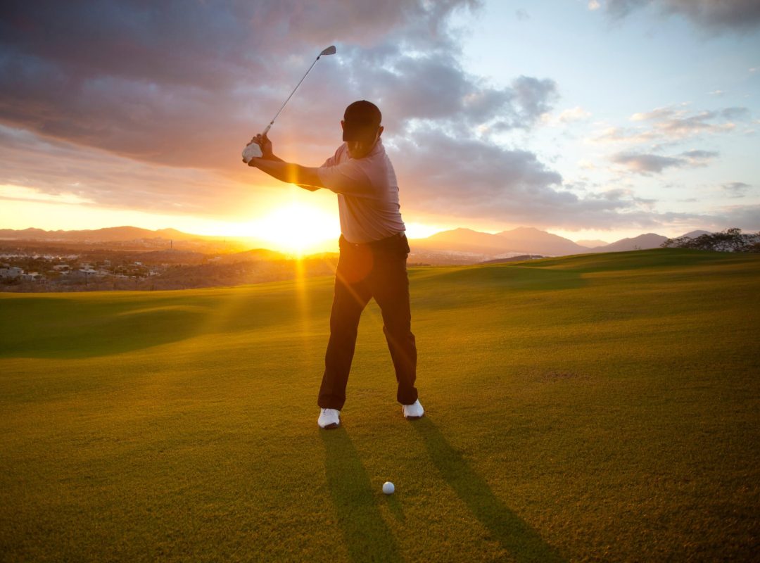 male golfer hitting ball on world class golf course in Mexico.